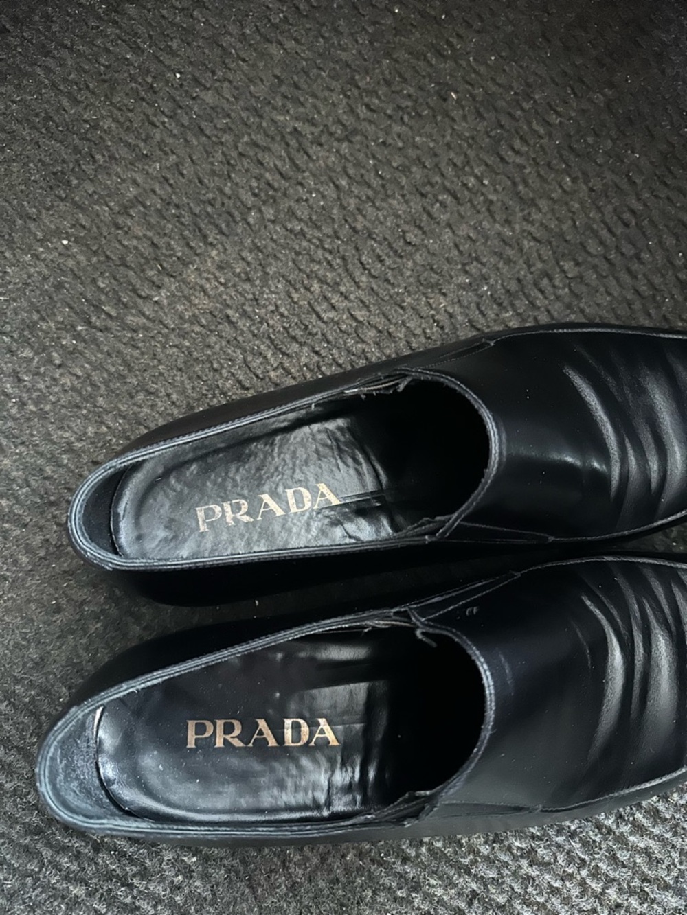 Prada Black Leather Slip-On Loafers with Gold Logo